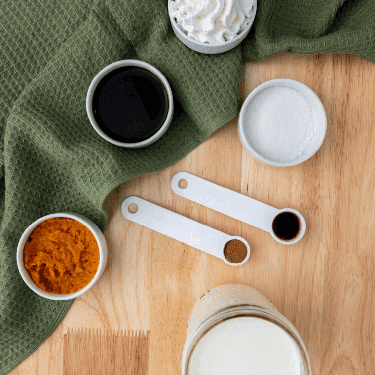 Cinnamon, ginger, nutmeg, and allspice measured in bowls to make copycat McCormick pumpkin pie spice