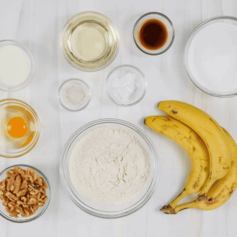 Ingredients needed for Instant Pot Banana Pecan Bundt Cake  on kitchen table.