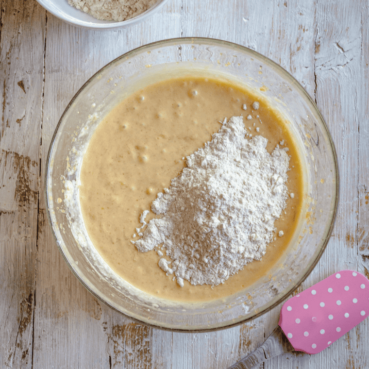 Greased small bundt pan prepared with nonstick spray for Instant Pot banana pecan cake cooking setup