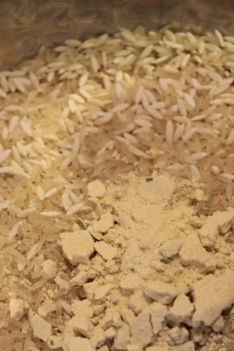 Adding Rice-A-Roni mix, water, and butter into Instant Pot