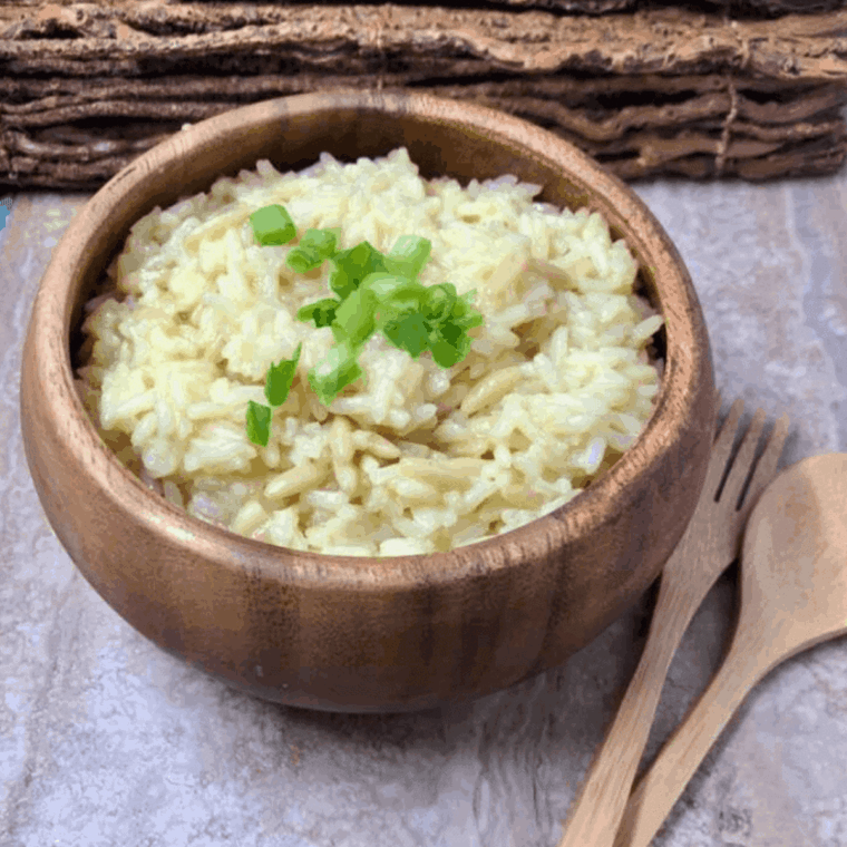 Plate of Instant Pot Rice-A-Roni in wooden bowl on kitchen table.