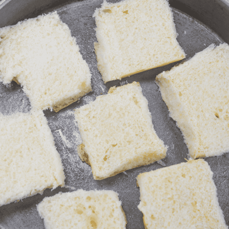 Cut Hawaiian Rolls on baking sheet, ready to be filled.