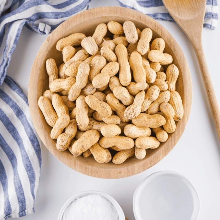 Ingredients needed for Easy Cajun Boiled Peanuts in Crockpot  on kitchen table.