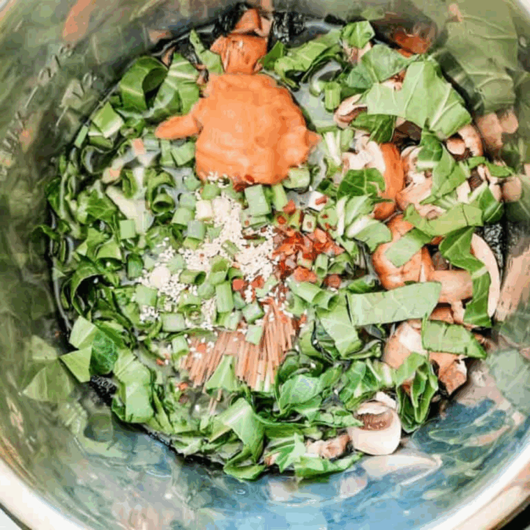 All miso soup ingredients added to the Instant Pot, set to high pressure for cooking, ready for quick release.