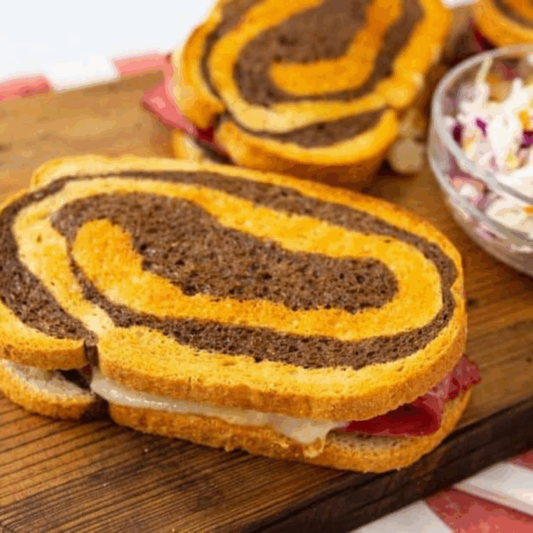 Extra Crispy Air Fryer Reuben Sandwich with melted Swiss cheese and golden toasted bread.