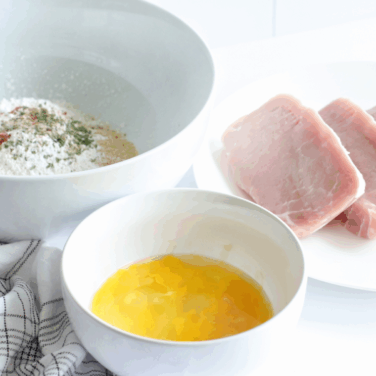 Ingredients needed for Shake &lsquo;N Bake Style Pork Chops in the Ninja Foodi on kitchen table.