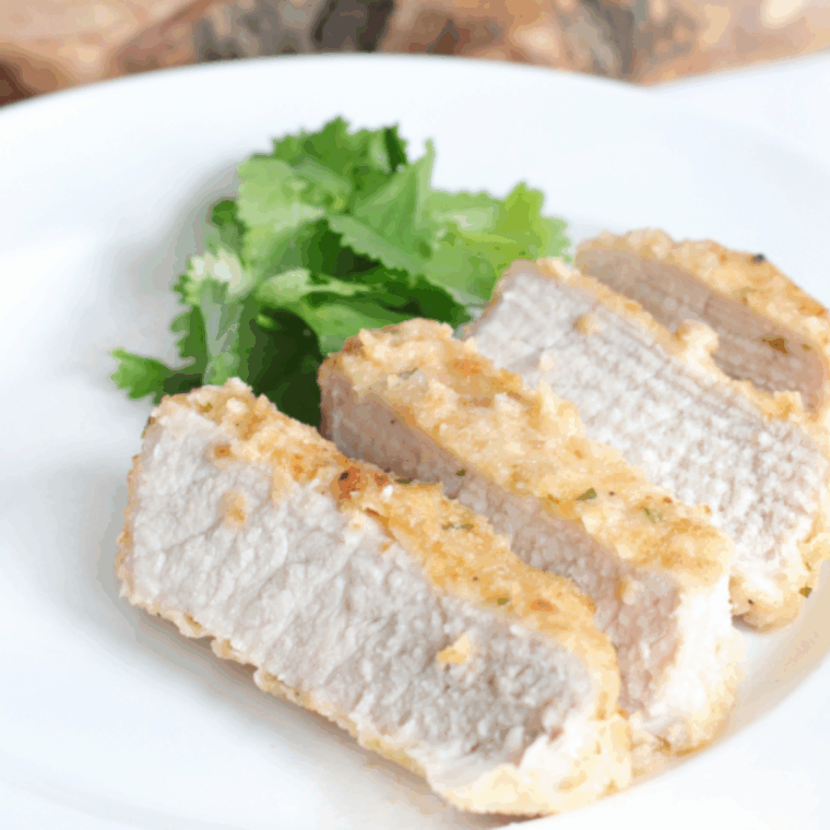 Shake &lsquo;N Bake style pork chops in the Ninja Foodi, golden and crispy, ready to serve.