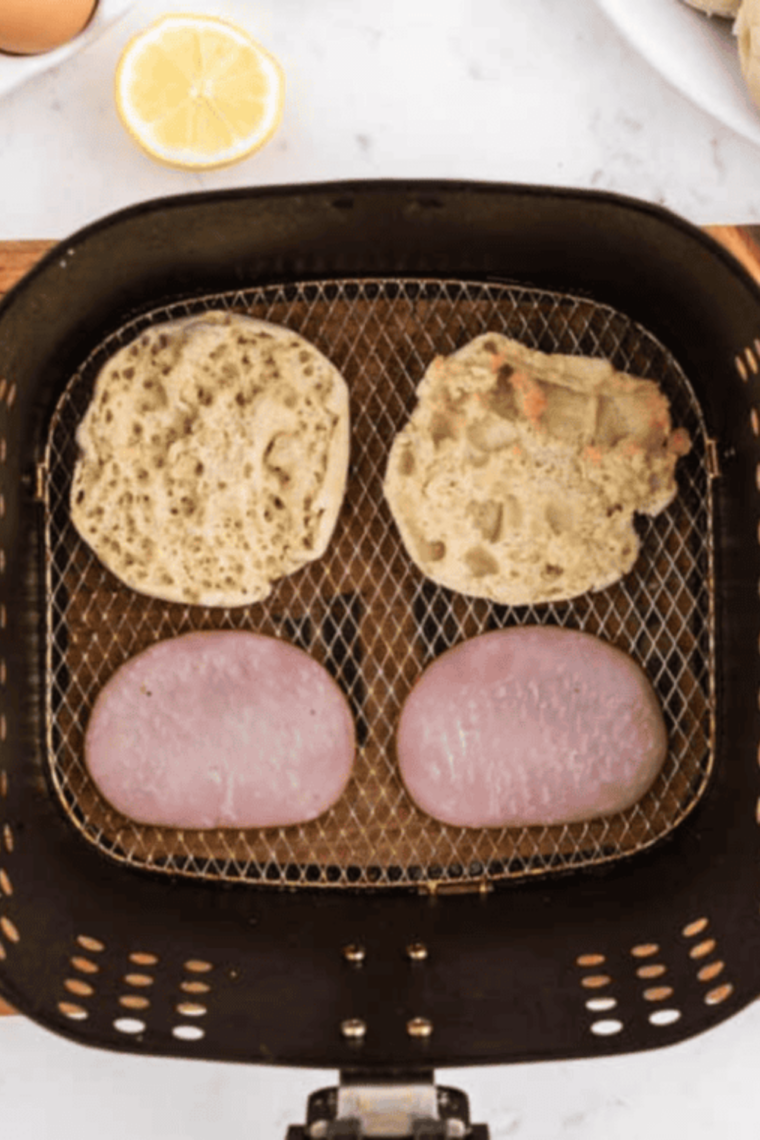 Slowly drizzling melted butter into egg yolks while blending to make smooth hollandaise sauce.