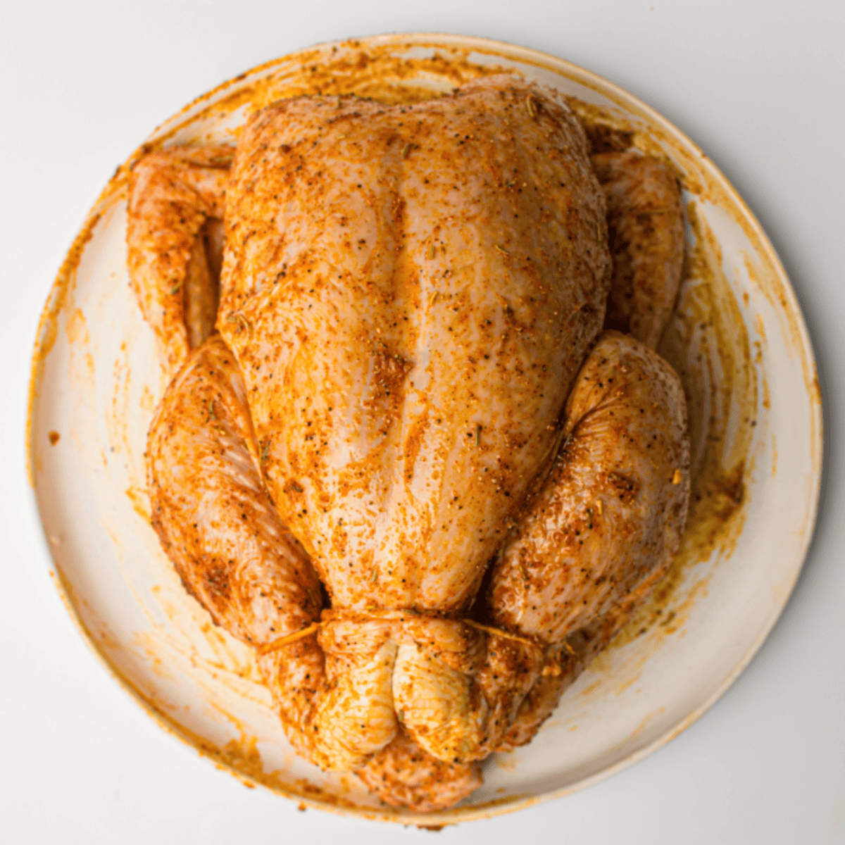 Roasting whole chicken in oven, resting after cooking, then carved and served with vegetables and mashed potatoes.
