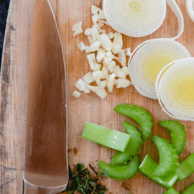 saut&eacute;ed leek, celery, garlic, and fresh thyme in melted butter in pan