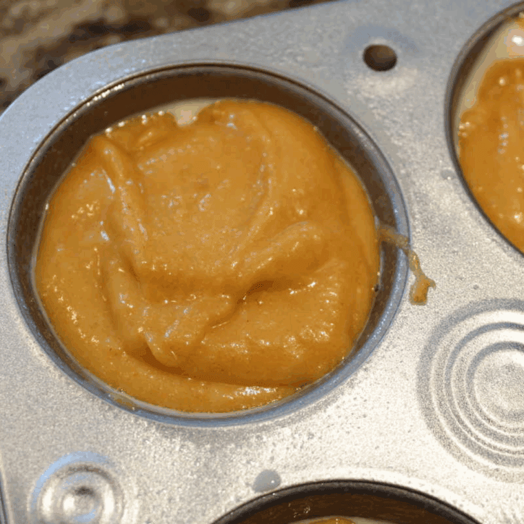 Air Fryer Pumpkin Muffins in muffin tin, ready for air frying.