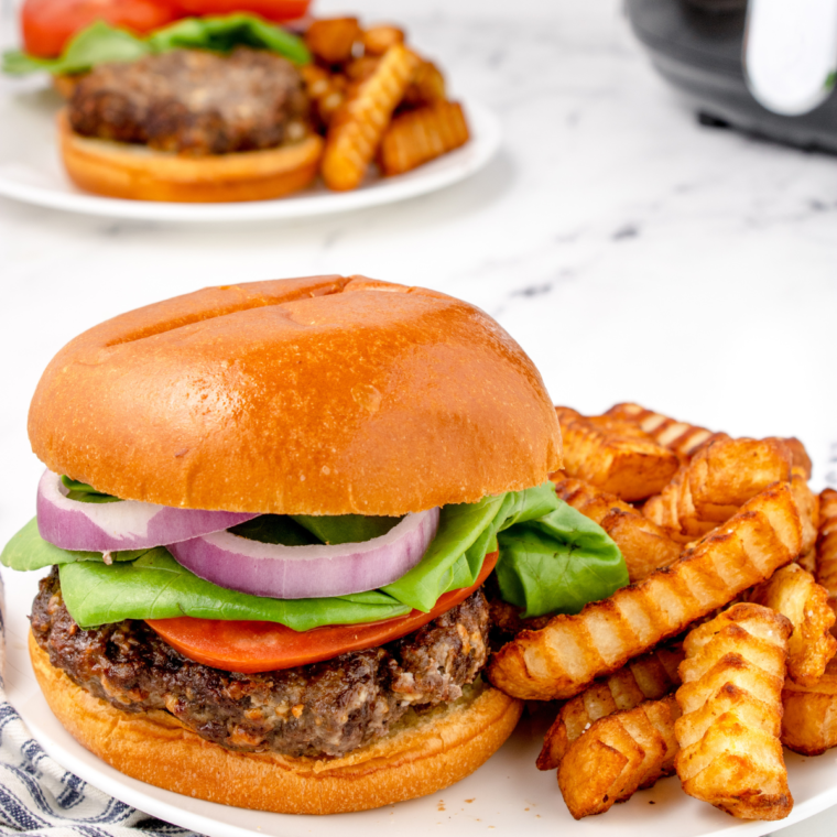 Creating the perfect Air Fryer Blue Cheese Burgers involves some key tips and tricks. Here are some pro tips to help you achieve the best results: Choosing the Right Beef: Opt for ground beef with a bit of fat content, like an 80/20 mix. The fat adds flavor and juiciness to the burgers. Handling the Meat: Mix the ground beef gently with the blue cheese and seasonings. Overworking the meat can lead to tough burgers. Patty Thickness: Aim for patties that are about ¾ inch thick. This ensures they cook evenly and stay juicy. Indentation Trick: Make a small indent in the center of each patty with your thumb. This prevents the burgers from puffing up in the middle and helps them cook evenly. Room Temperature Patties: Let the patties sit at room temperature for about 10-15 minutes before cooking. This helps them cook more evenly. Preheating the Air Fryer: Always preheat your air fryer. A hot air fryer ensures a good sear and even cooking. Avoid Overcrowding: Cook the burgers in batches if necessary. Overcrowding the air fryer can lead to uneven cooking. Flipping Once: Flip the burgers only once during cooking. This will give you a nice crust and juicy interior. Checking Doneness: Use a meat thermometer to ensure the burgers have reached the desired doneness - 160°F for medium. Resting the Burgers: Let the burgers rest for a few minutes after cooking. This allows the juices to redistribute throughout the patty. Cheese Melting: If you prefer extra melted blue cheese, add a small amount on top of the burgers during the last minute of cooking. Toasting the Buns: Lightly toast the buns in the air fryer for a minute before assembling your burgers. This adds a nice texture and prevents the buns from getting soggy. By following these tips, you'll be able to craft delicious and juicy Air Fryer Blue Cheese Burgers that are sure to impress!