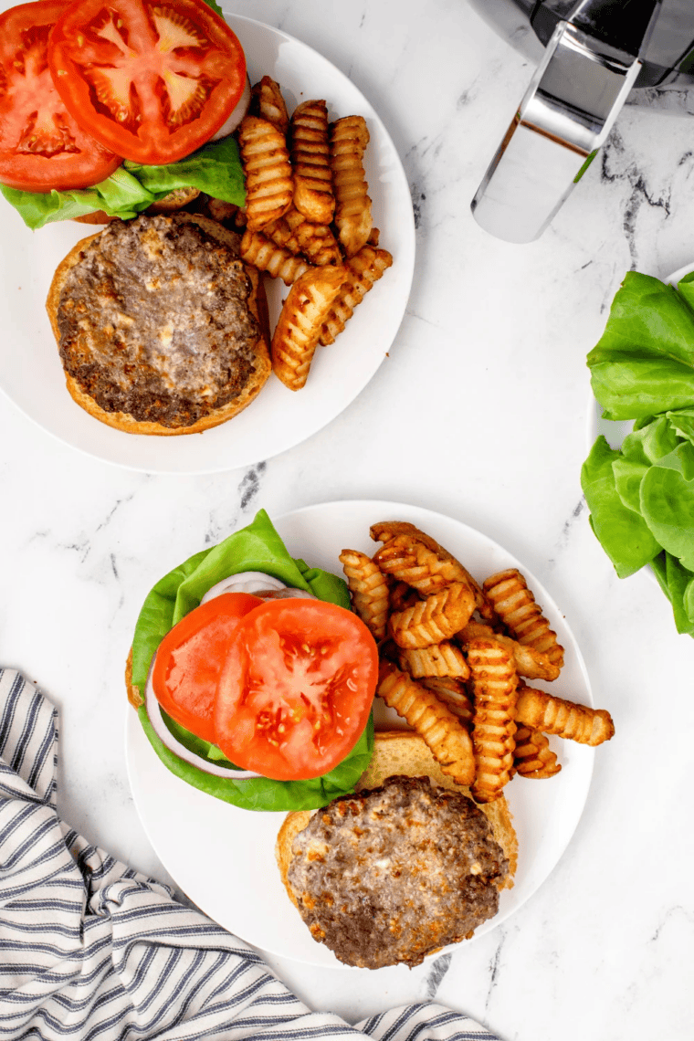 Air fryer blue cheese burger with melted crumbles on a toasted brioche bun