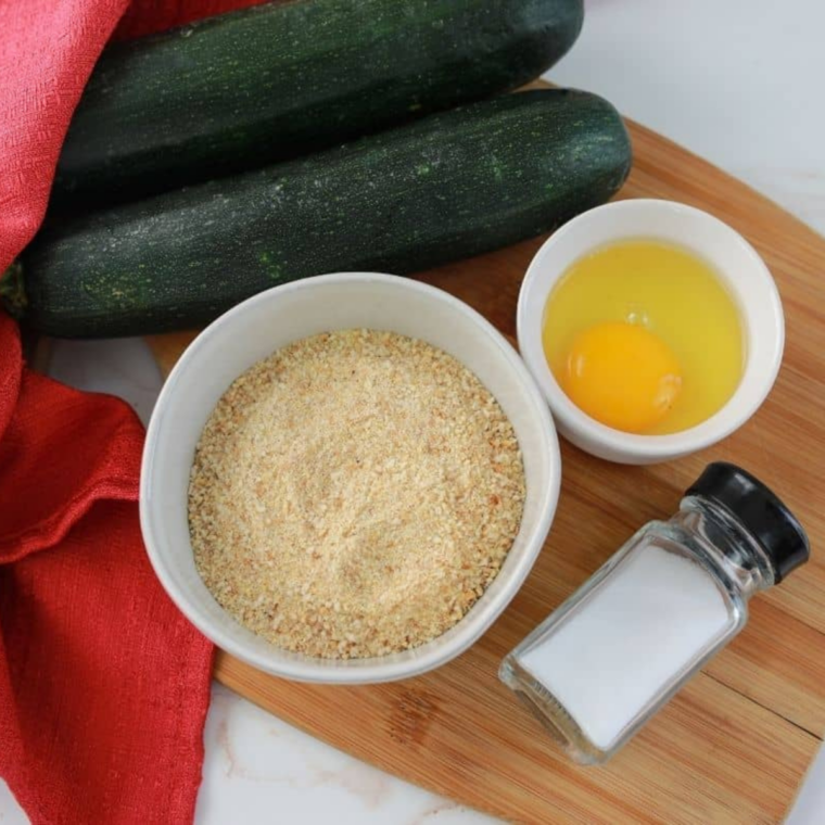 Ingredients needed for Air Fryer Copycat Hamburger Hamlet&rsquo;s Zucchini Zircles on kitchen table.