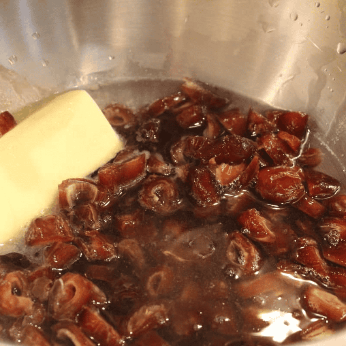 Add the dates and water into a large mixing bowl.