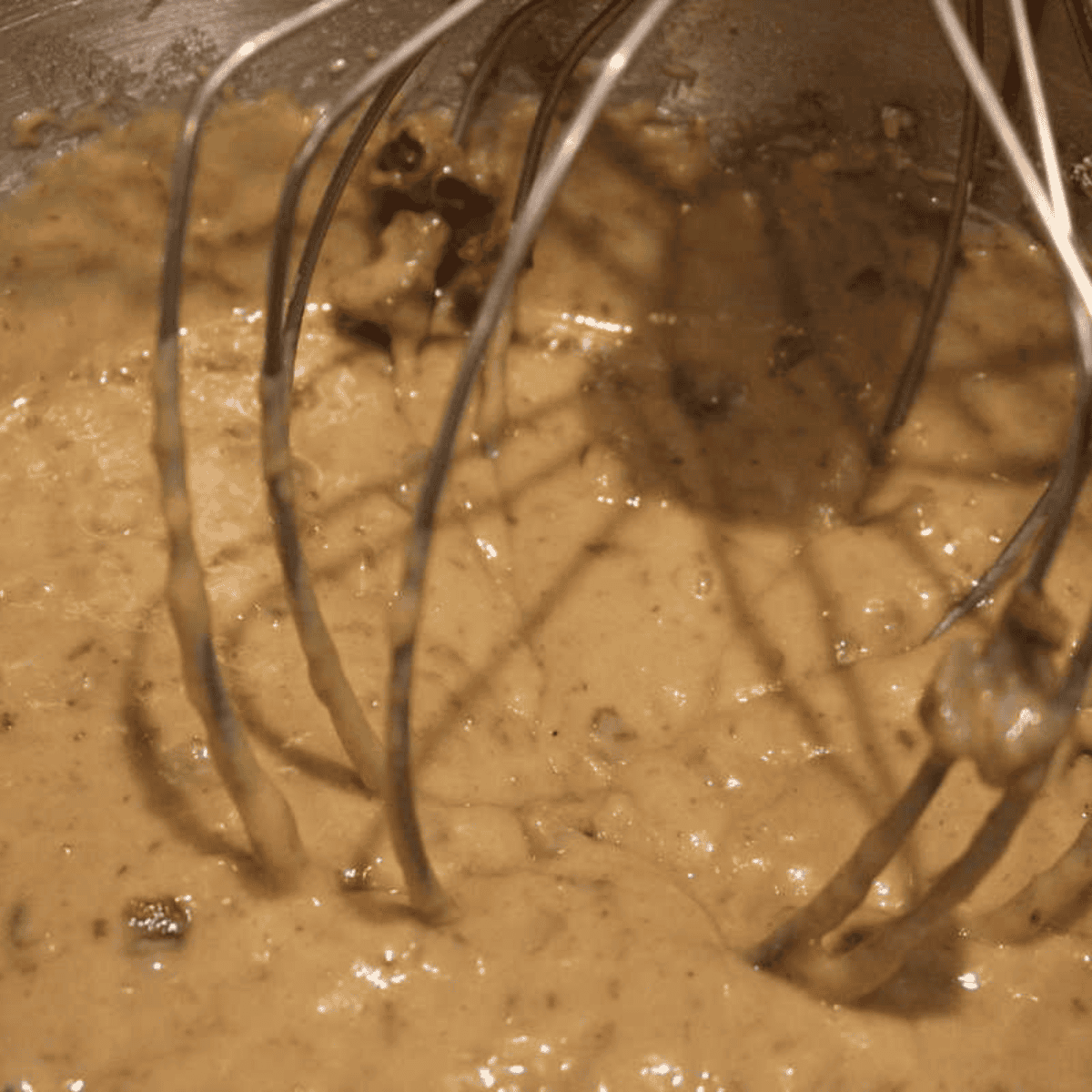 Mixing brown sugar, egg, flour, baking soda, baking powder, and salt in a bowl