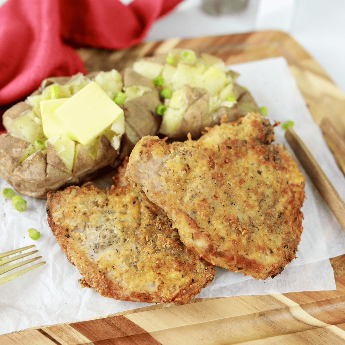 Applebee’s Parmesan pork chops with crispy cheese crust on plate