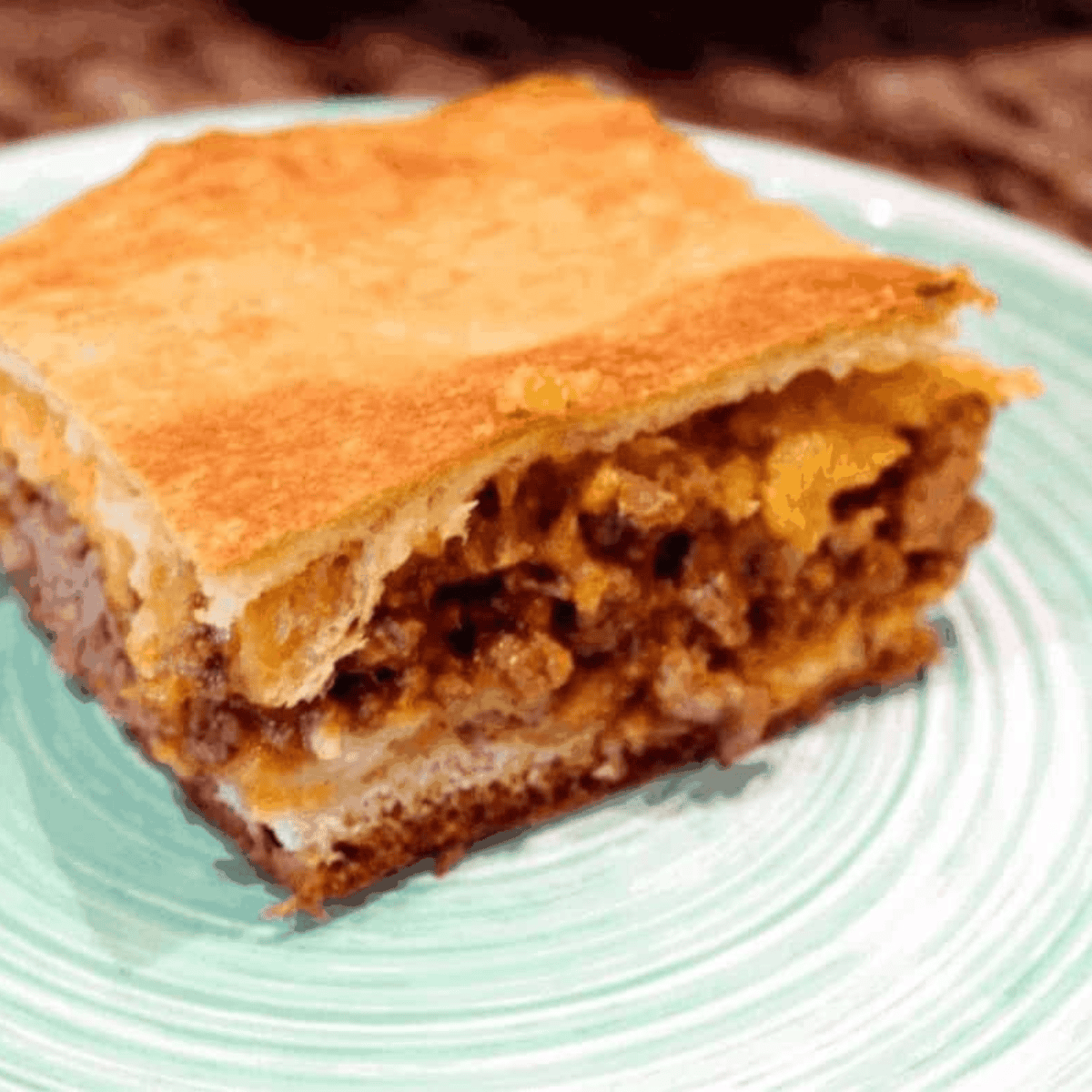 Air fryer sloppy joe taco bake with seasoned beef and melted cheese in baking dish