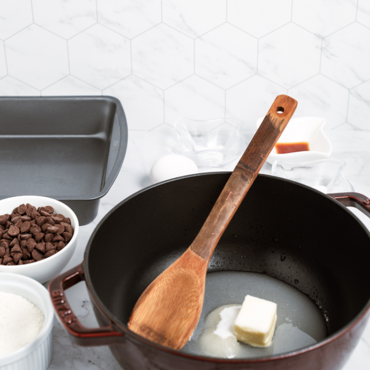Melted butter whisked with granulated and brown sugar in a glass mixing bowl
