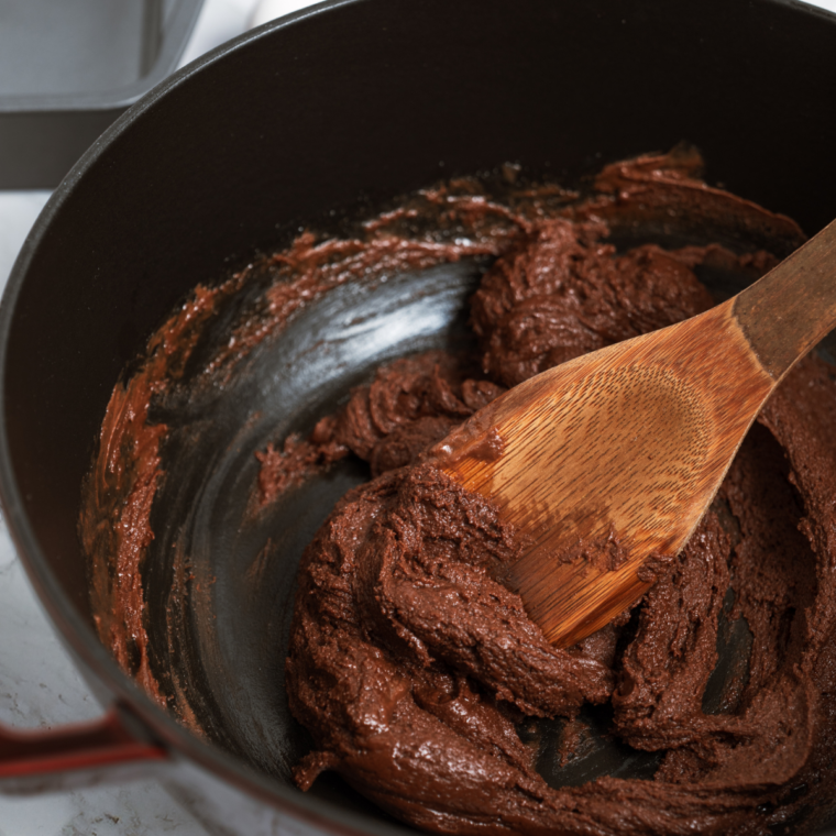 Cocoa powder, flour, and salt sifted over wet brownie batter before folding