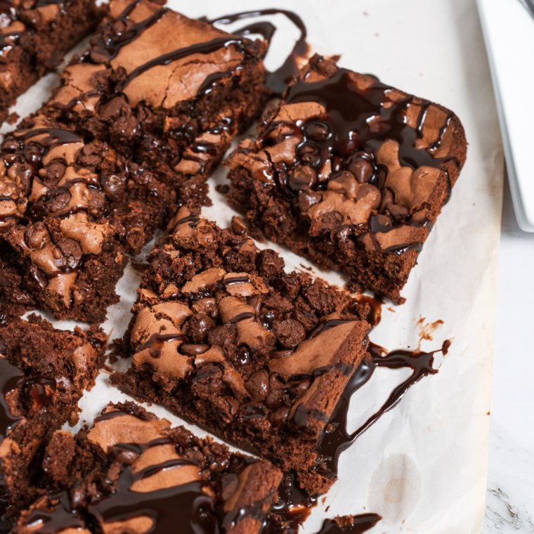 Copycat Starbucks double chocolate brownies cut into squares with chocolate chunks on top
