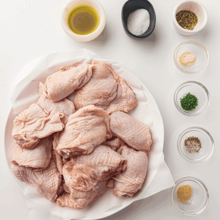 Ingredients needed for Easy Air Fryer Lemon Garlic Chicken Thighs on kitchen table.