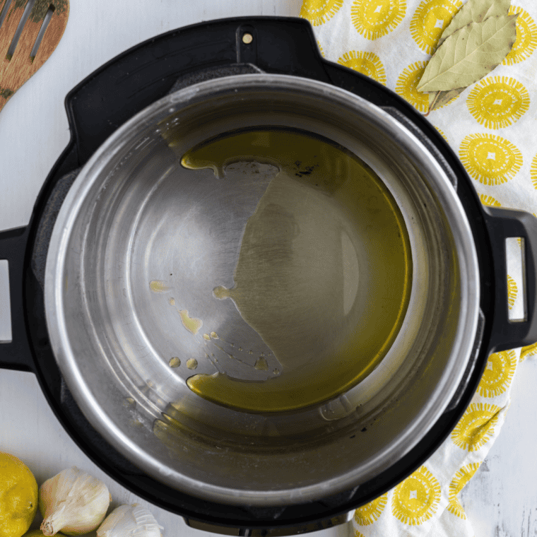 Diced chicken browning in olive oil in the Instant Pot on Saut&eacute; mode for Greek lemon chicken soup.
