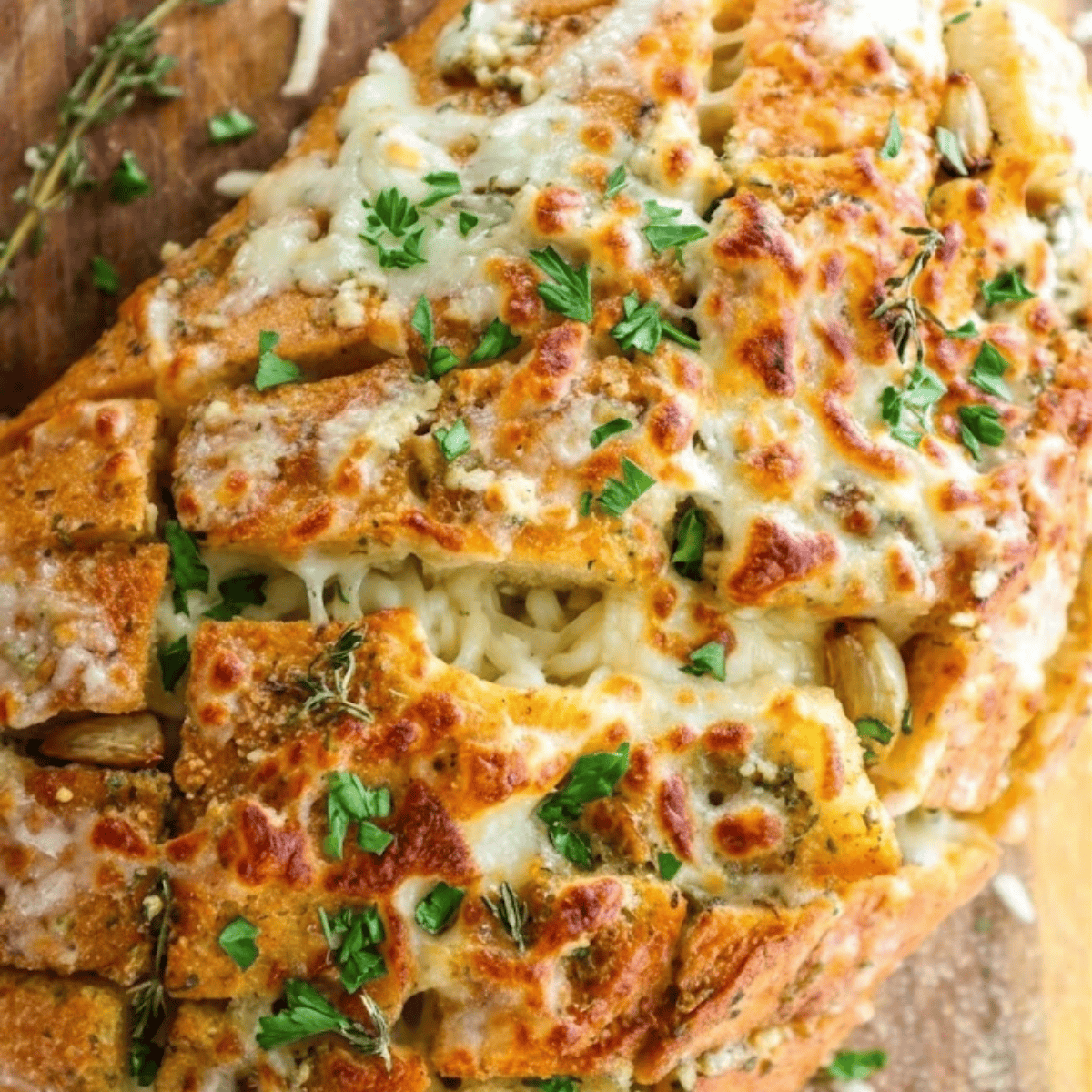 Close-up of Air Fryer Cheesy Garlic Bread Rolls with bubbly melted cheese and crispy golden edges