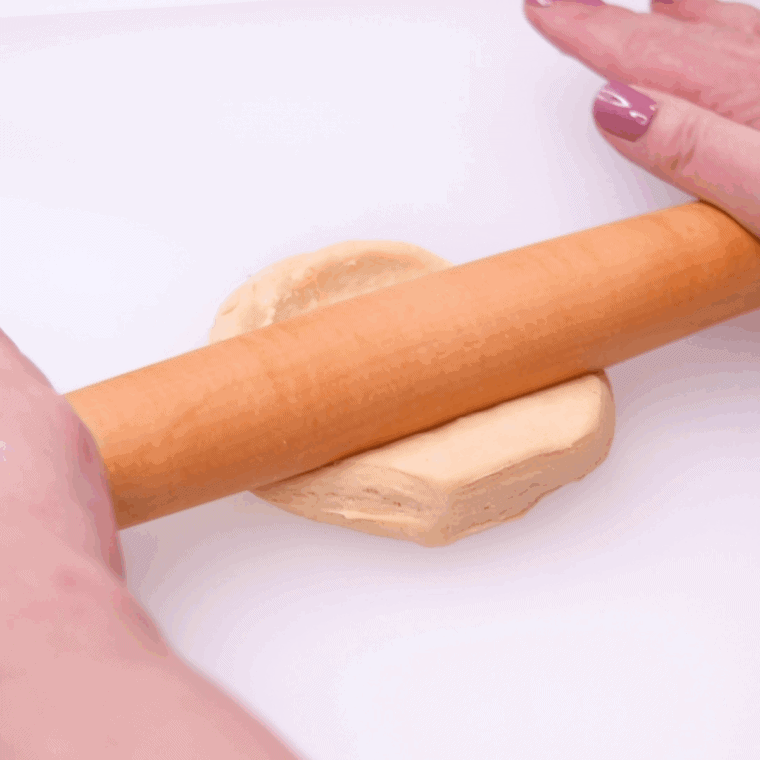 Roll out the biscuit with a rolling pin.