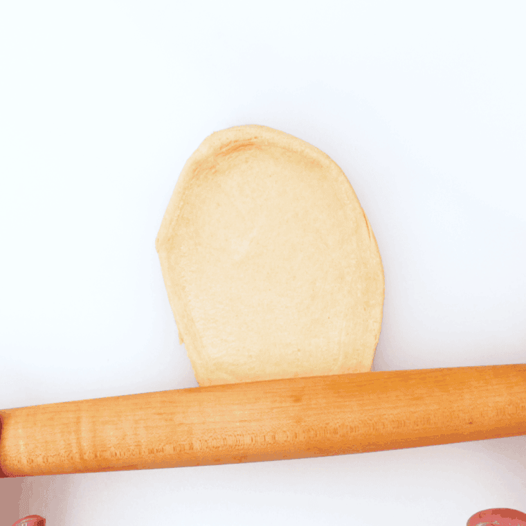 Stretched dough on the kitchen table.