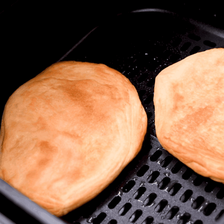 Fried Dough in air fryer basket cooked.