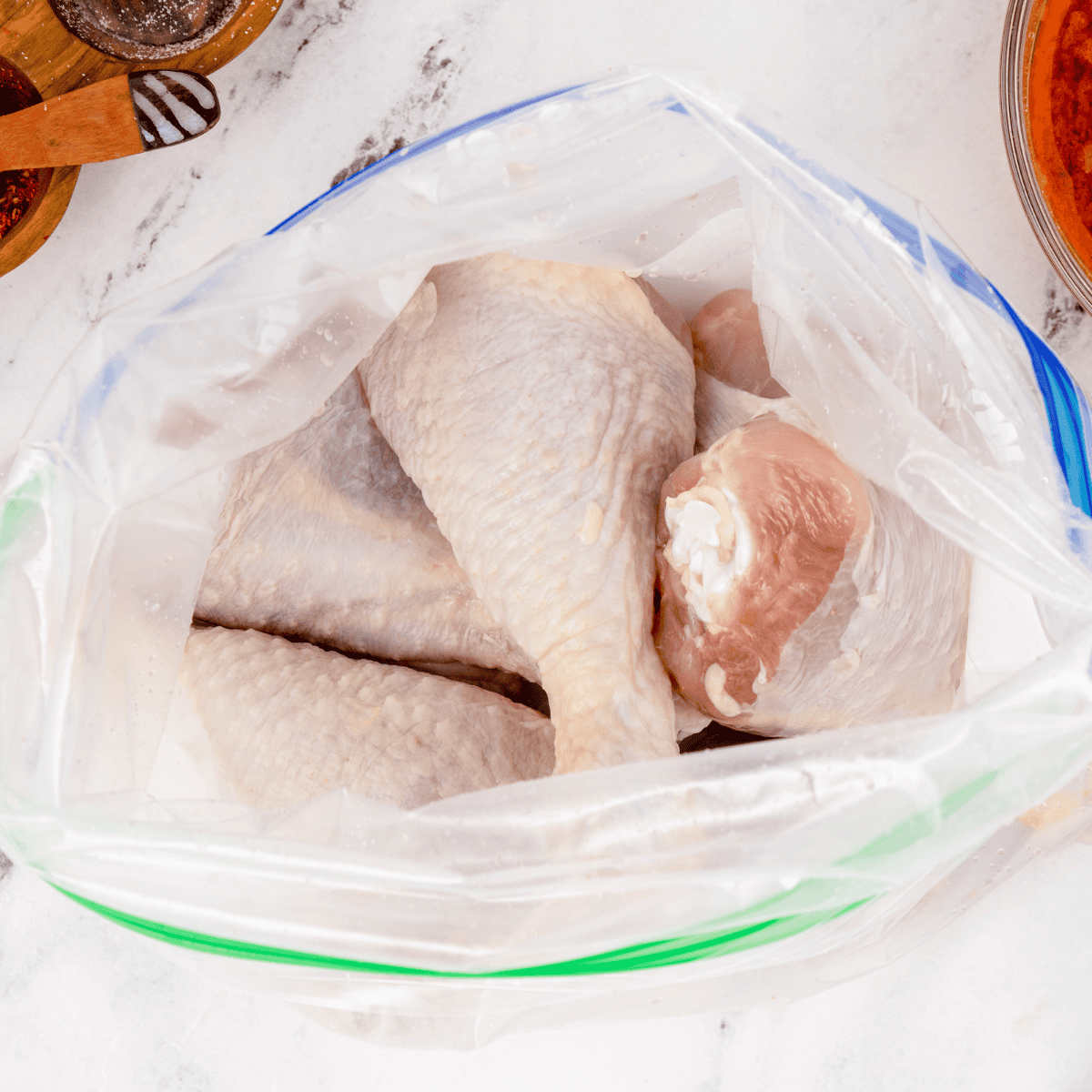 Ingredients needed for Air Fryer Garlic Paprika Chicken Drumsticks on kitchen table.