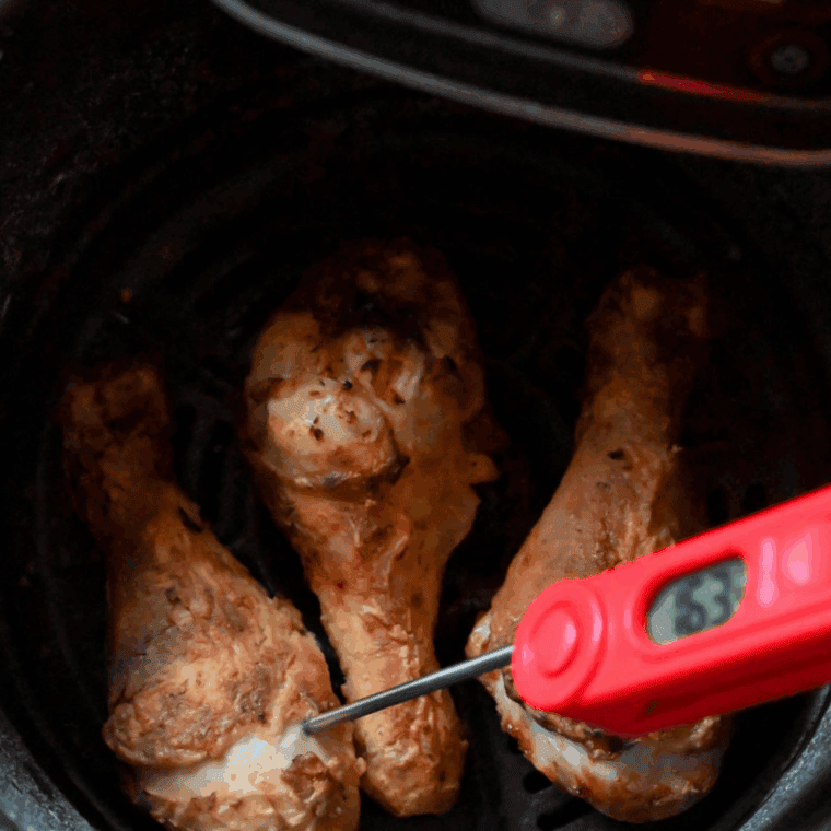 Place the chicken drumsticks into the air fryer basket.