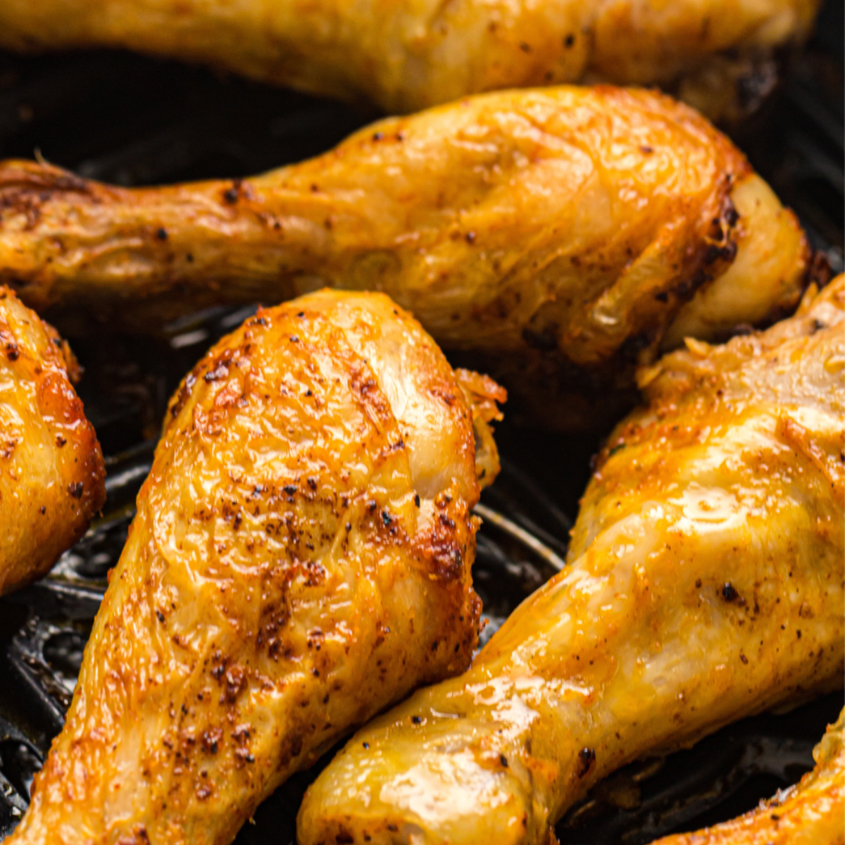 Garlic paprika chicken drumsticks on a white plate