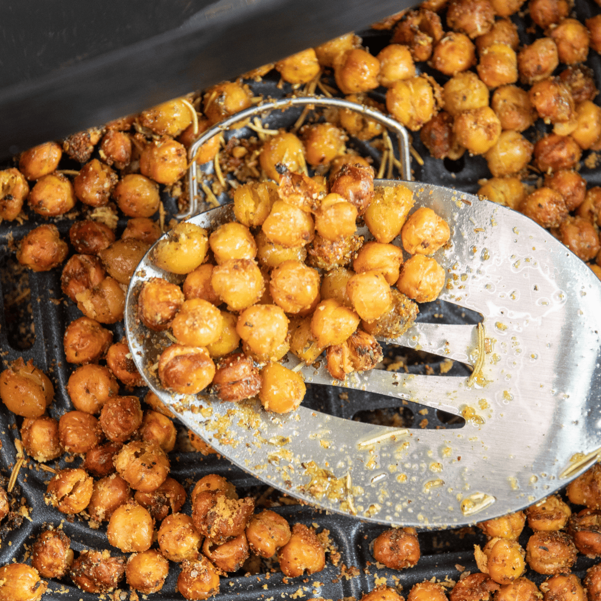 Air fryer honey cinnamon roasted chickpeas in a white bowl, crispy and golden