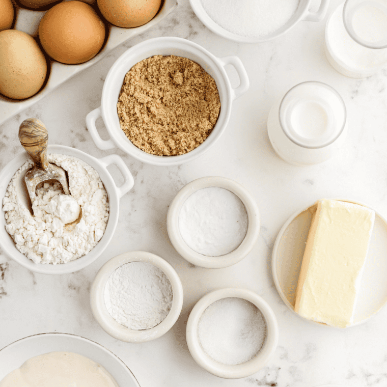 Ingredients for air fryer Navajo fry bread, including flour, baking powder, salt, milk, and oil on a marble counter.