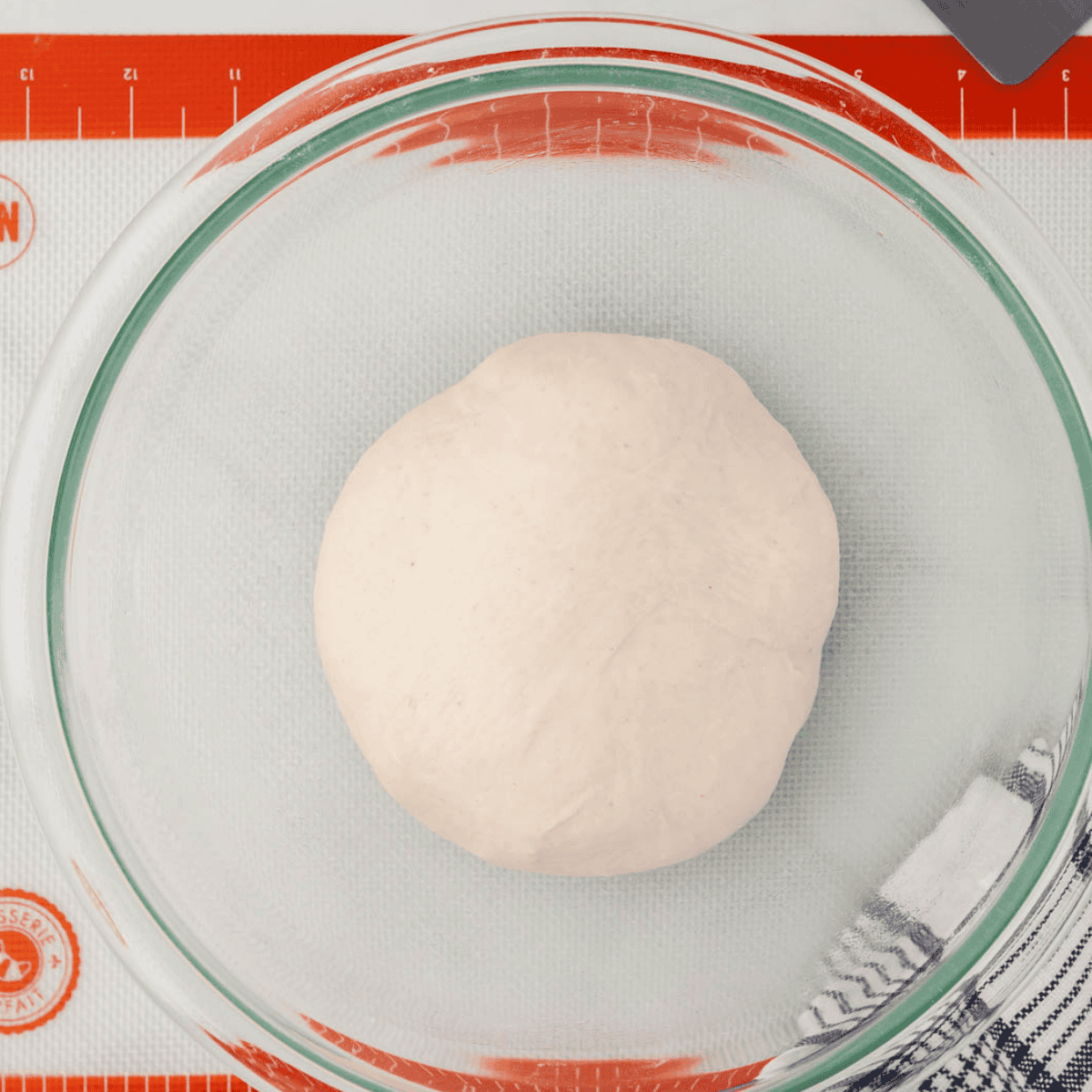 Kneading fry bread dough on a floured surface until smooth and soft