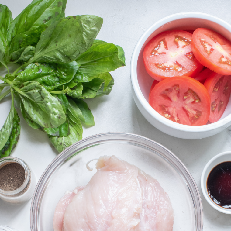 Ingredients for air fryer caprese garlic bread including ciabatta, butter, garlic, mozzarella, tomatoes, basil, and balsamic vinegar