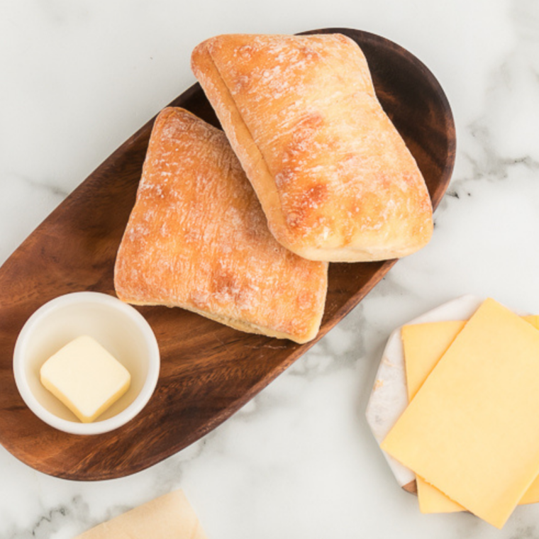 Ciabatta loaf cut in half and trimmed to fit inside an air fryer basket