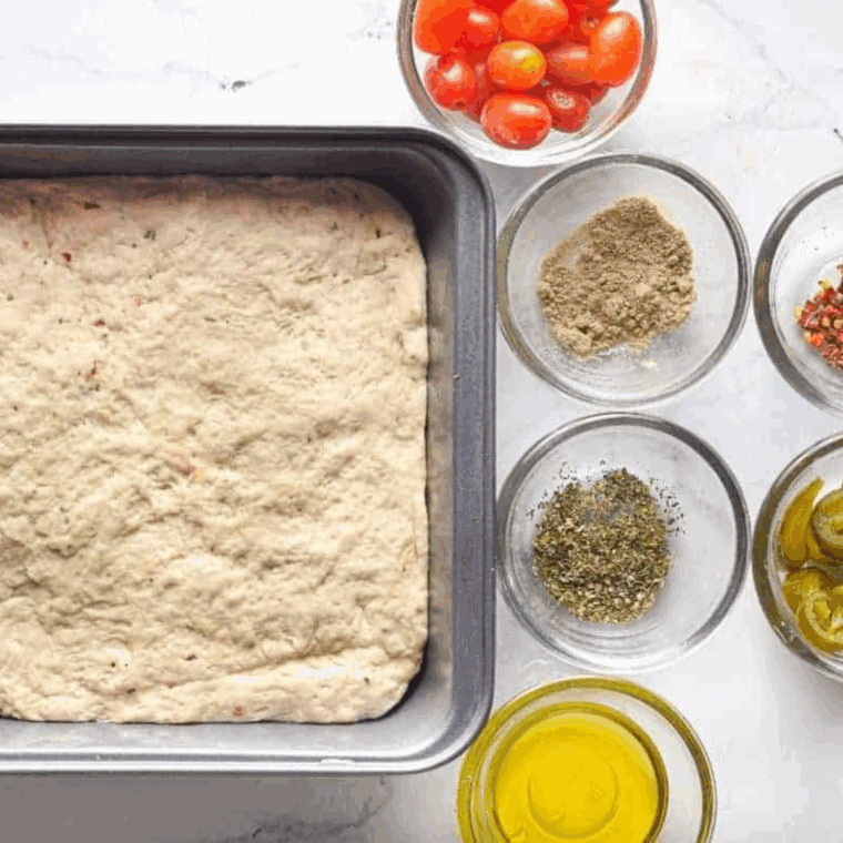 Ingredients needed for Air Fryer Cheesy Bread Sticks on kitchen table.