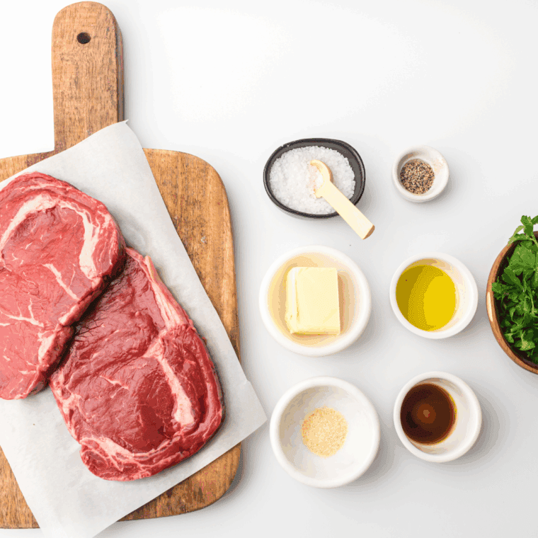 Ingredients needed for Easy Bourbon Marinated Steak Tips on kitchen table.