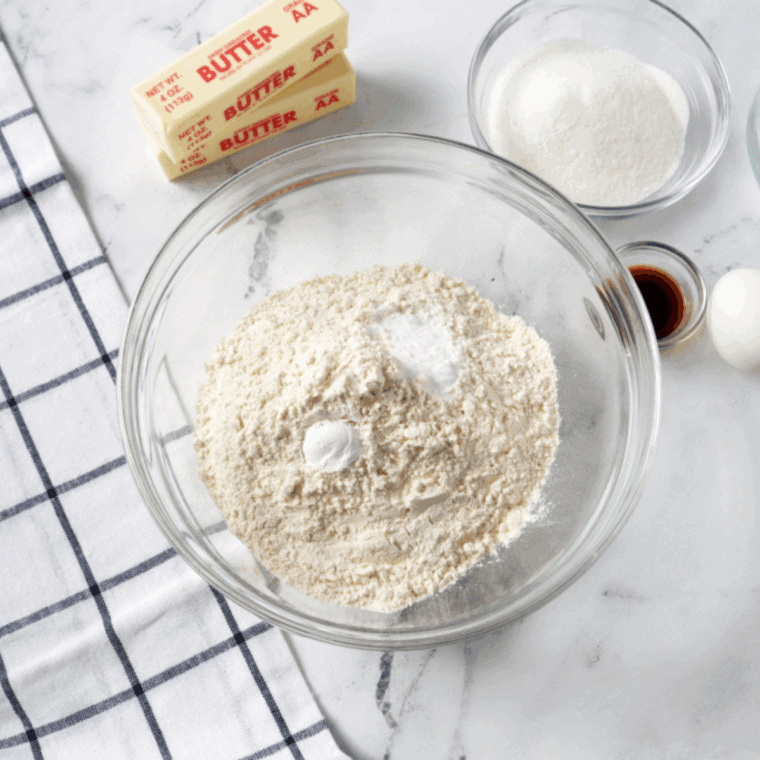 Ingredients needed for Air Fryer Blackberry Lemon Poppy Seed Muffins on kitchen table.