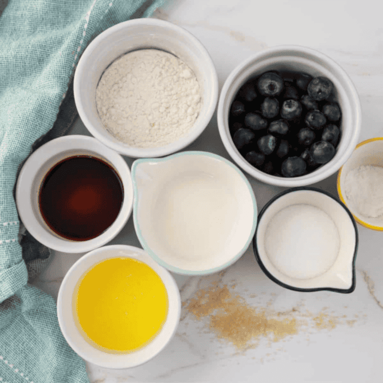 Ingredients needed for Easy Air Fryer Blueberry Hand Pies on kitchen table.