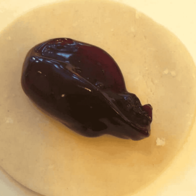 Cutting 2-inch circles from pie dough using cookie cutter or glass rim