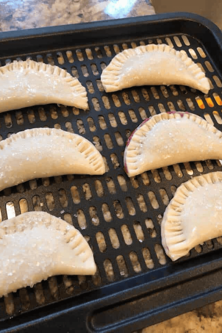 Place  Blueberry Hand Pies on the air fryer tray or in the air fryer basket.