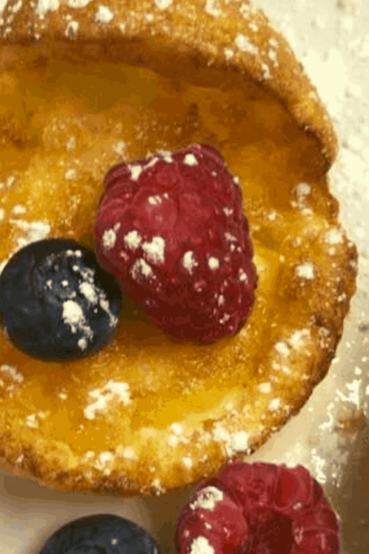 Golden mini Dutch pancakes baked in air fryer fluffy center crisp edges powdered sugar topping