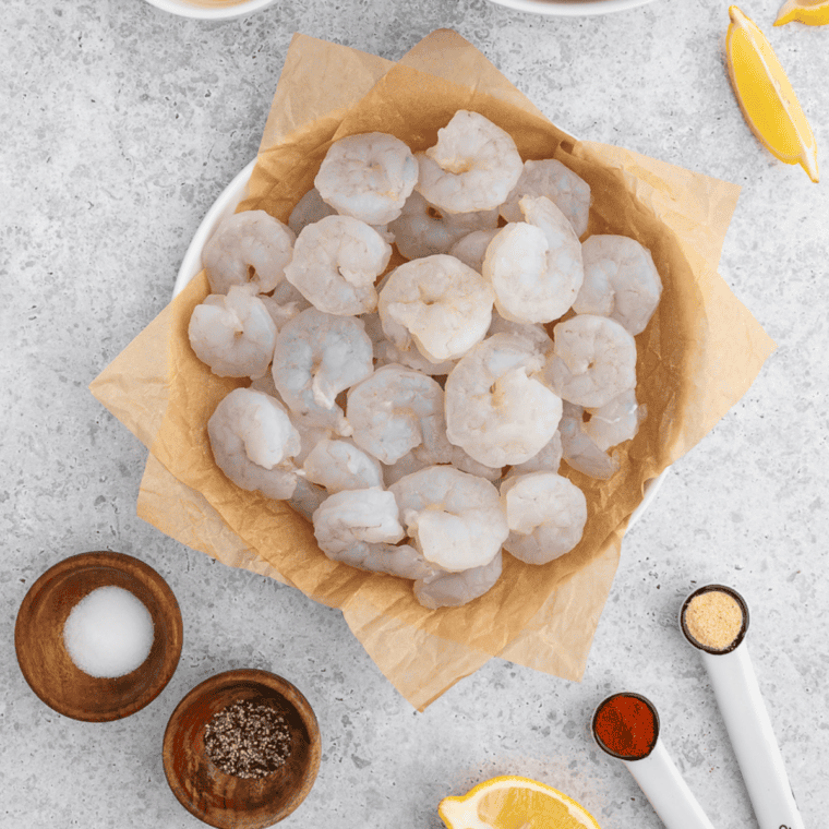 Ingredients needed for Air Fryer Garlic Butter Shrimp Scampi on kitchen table.