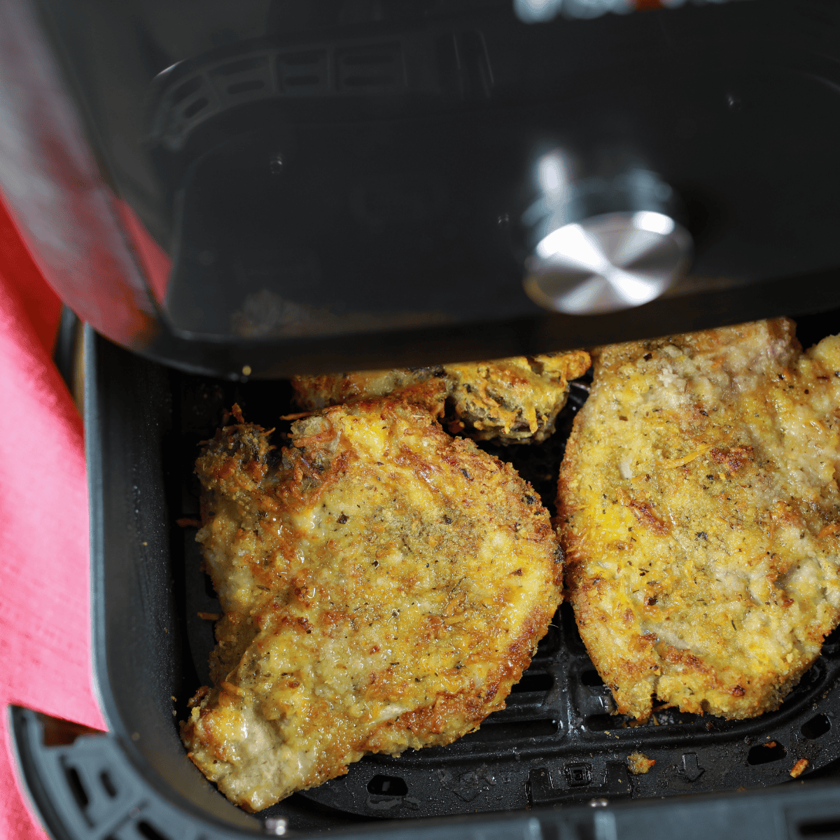 Crispy golden Parmesan crusted pork chops, copycat of Outback Steakhouse.
