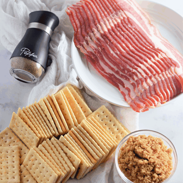 Ingredients needed for Easy Air Fryer Bacon Wrapped Crackers on kitchen table.