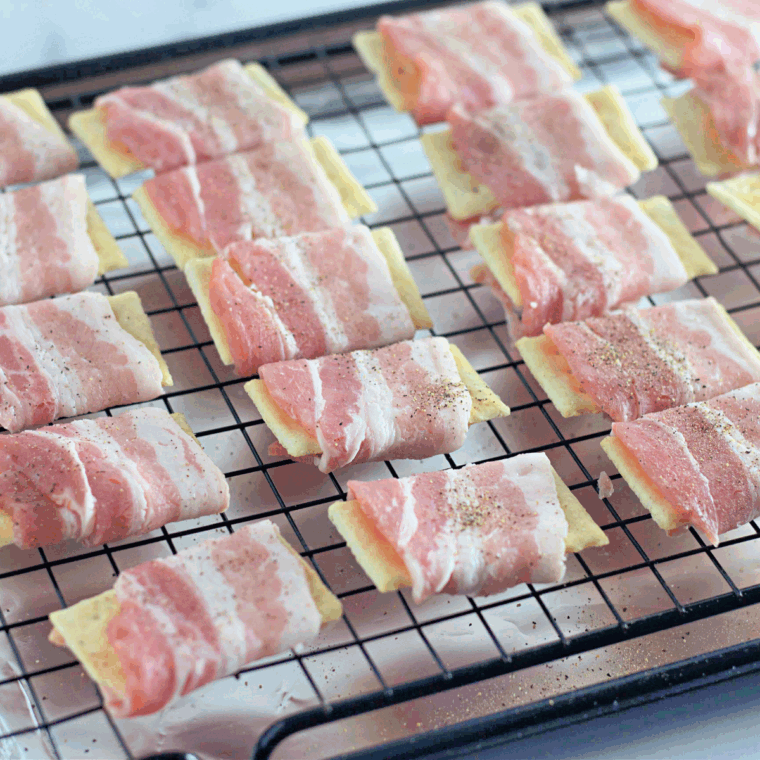 Arrange crackers on a tray and sprinkle grated cheese on top.”